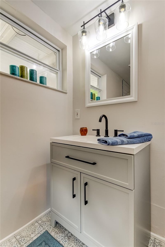 bathroom with vanity and tile patterned floors