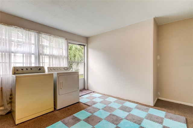 clothes washing area with carpet flooring and independent washer and dryer