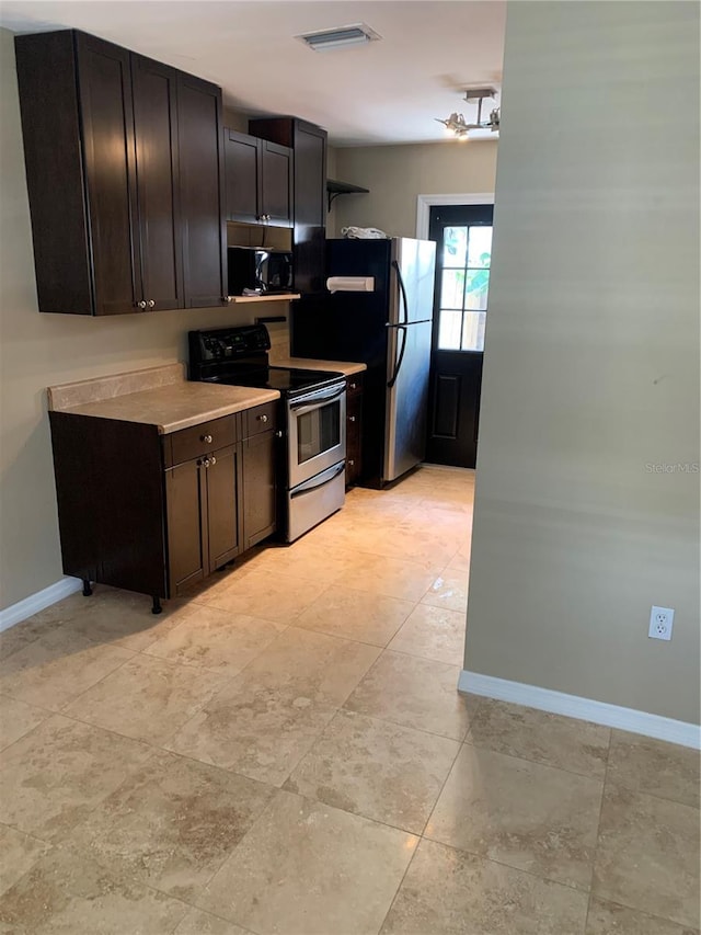 3402 W Obispo St, Tampa, FL 33629 - kitchen with appliances with stainless steel finishes and dark brown cabinets