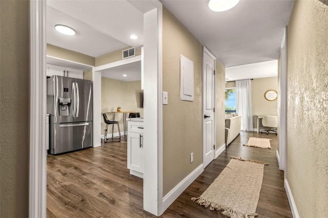 corridor featuring dark hardwood / wood-style floors