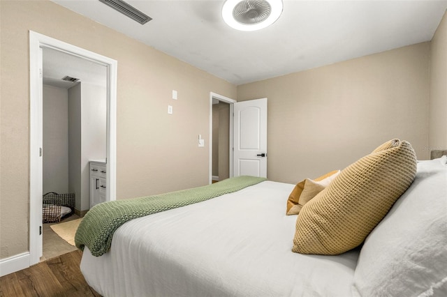 bedroom with wood-type flooring