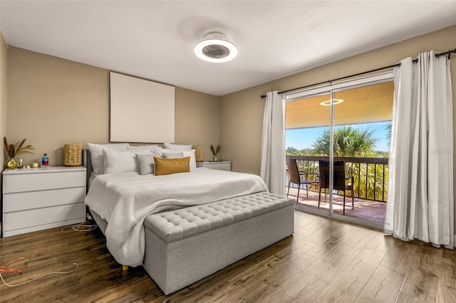 bedroom featuring access to outside, dark hardwood / wood-style floors, and ceiling fan