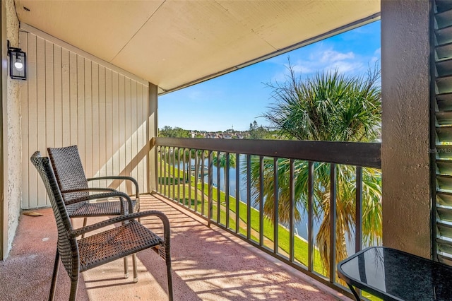 balcony featuring a water view