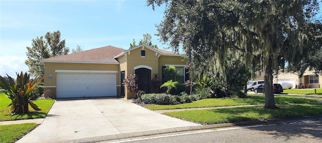 107 Slipper Key Rd, Apollo Beach, FL 33572 - view of front facade with stucco siding, an attached garage, concrete driveway, and a front lawn