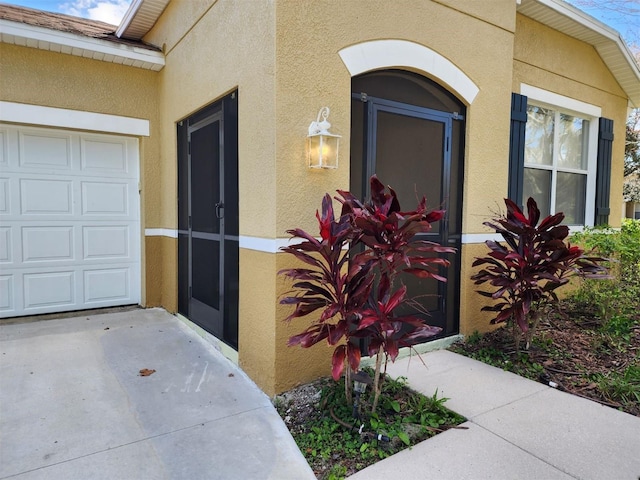 property entrance with a garage