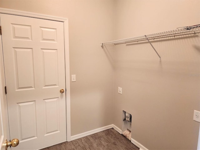 107 Slipper Key Rd, Apollo Beach, FL 33572 - washroom featuring hookup for an electric dryer, baseboards, and dark wood finished floors