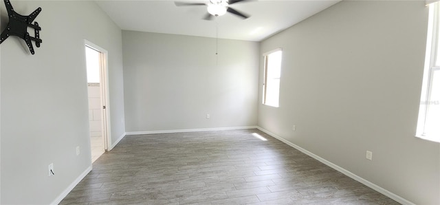 empty room with wood-type flooring and ceiling fan