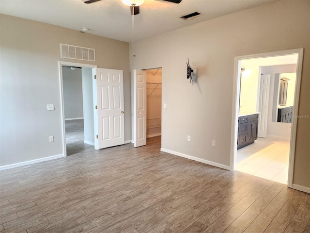 spare room with ceiling fan and light hardwood / wood-style floors