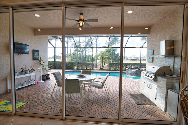 interior space featuring ceiling fan and grilling area