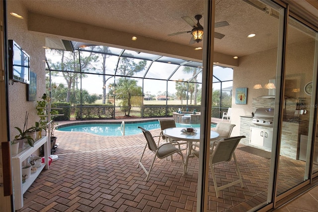 view of pool featuring grilling area, a lanai, and a patio area