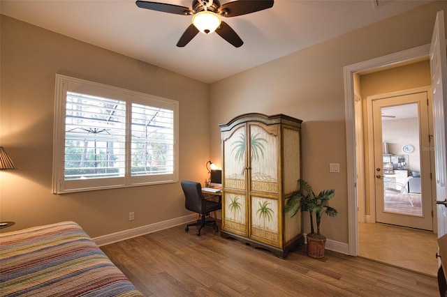 bedroom featuring ceiling fan and hardwood / wood-style floors