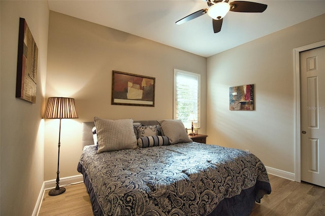 bedroom featuring ceiling fan and wood-type flooring