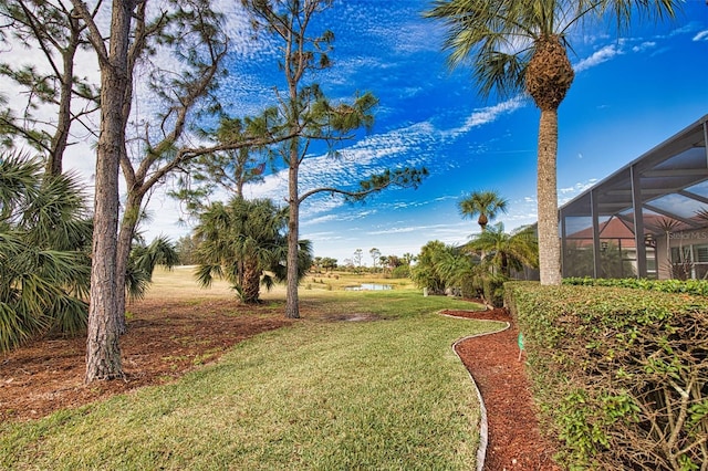 view of yard with a lanai