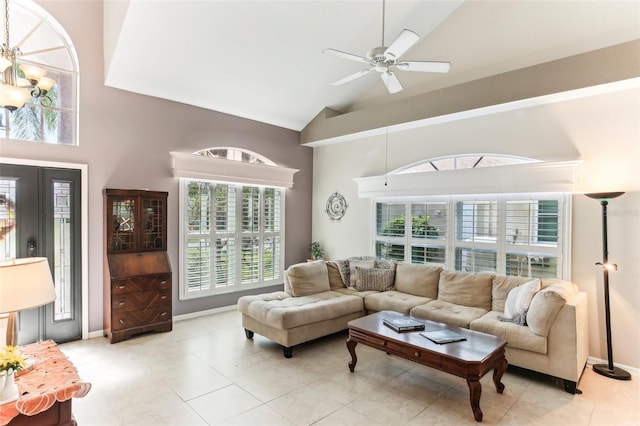 living room with ceiling fan, light tile patterned flooring, and high vaulted ceiling