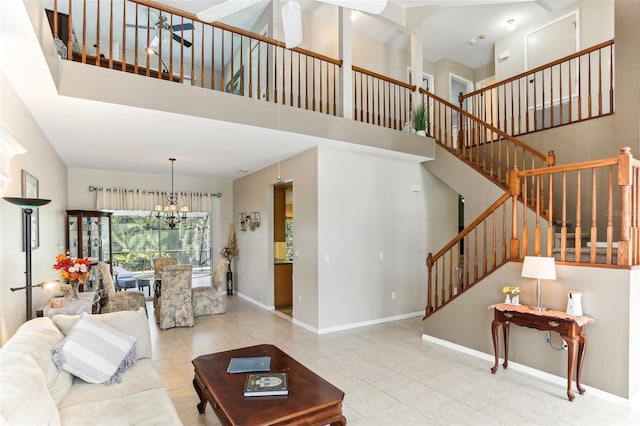 living room with light tile patterned flooring, a high ceiling, and a notable chandelier