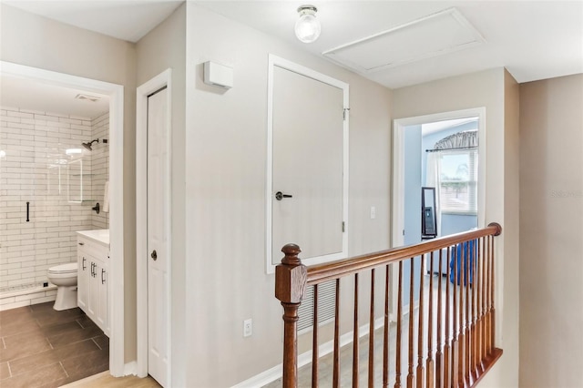 hall with light tile patterned floors