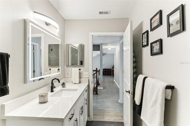 bathroom featuring vanity and wood-type flooring