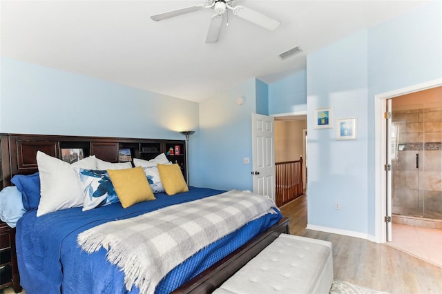 bedroom featuring ceiling fan, light hardwood / wood-style floors, and connected bathroom