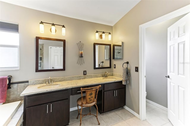 bathroom featuring tile patterned flooring, vanity, and toilet