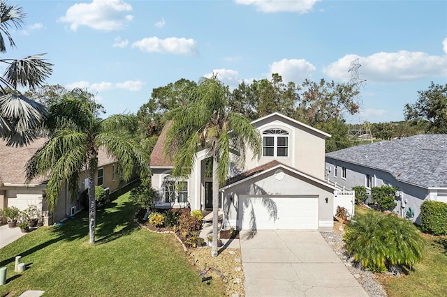 view of front of house featuring a garage and a front yard