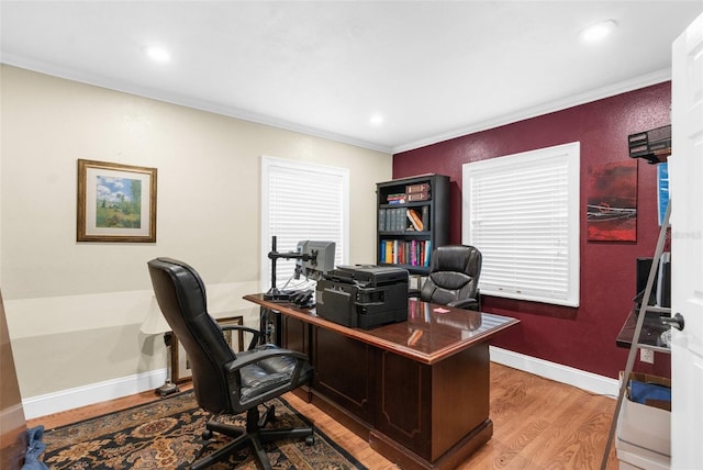 office space with light hardwood / wood-style flooring, plenty of natural light, and ornamental molding