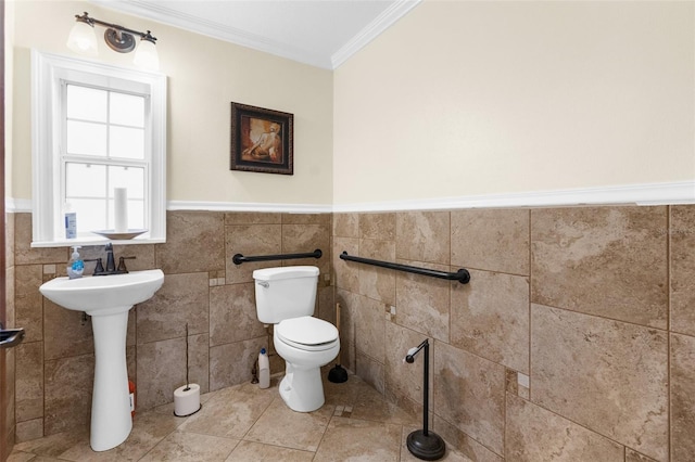 bathroom featuring crown molding, tile patterned flooring, tile walls, and toilet