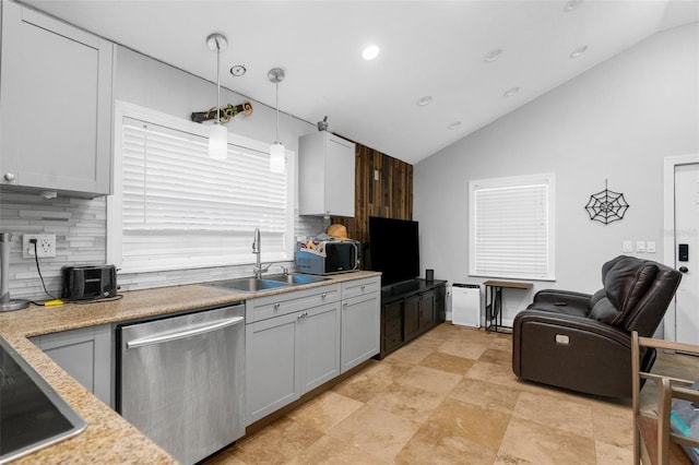 kitchen featuring dishwasher, sink, pendant lighting, vaulted ceiling, and decorative backsplash