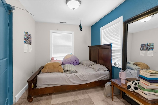 bedroom with multiple windows