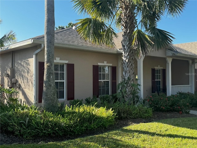 view of home's exterior with a yard