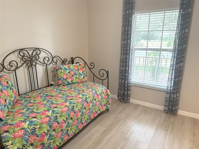 bedroom with light hardwood / wood-style flooring