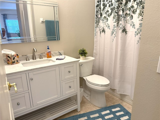 full bathroom with tile patterned floors, vanity, shower / bath combo, and toilet