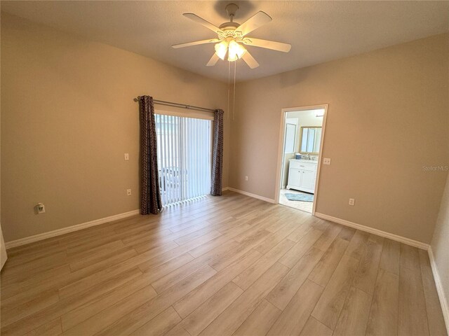 empty room with light hardwood / wood-style flooring and ceiling fan