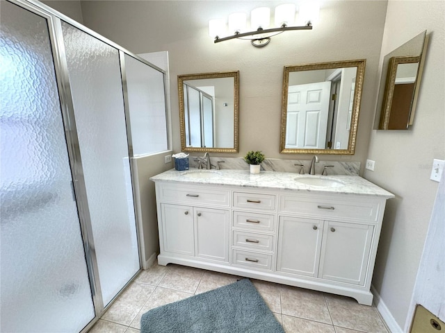 bathroom featuring vanity, tile patterned floors, and walk in shower