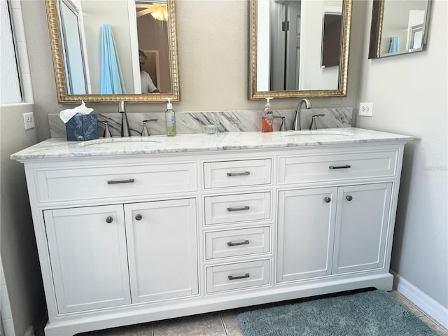 bathroom featuring vanity and ceiling fan