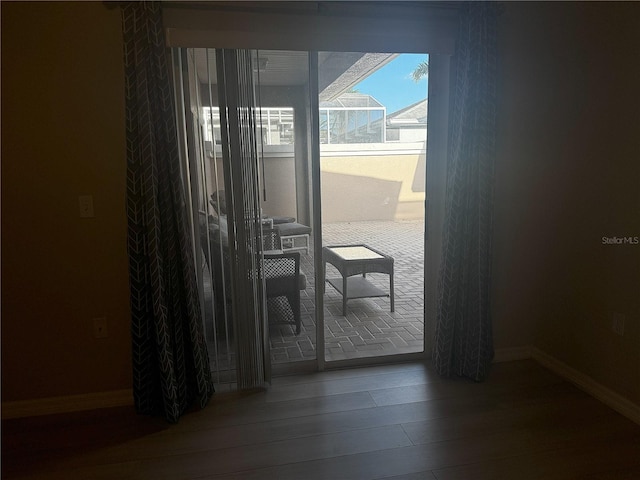 entryway with hardwood / wood-style floors