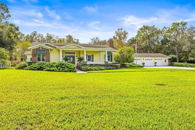 ranch-style home with a garage and a front lawn