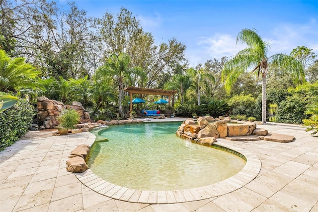 view of swimming pool with a pergola and a patio