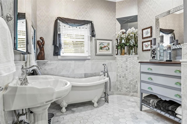 bathroom featuring a tub and tile walls