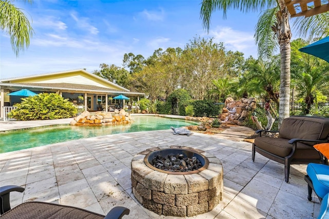 view of patio / terrace with a fire pit