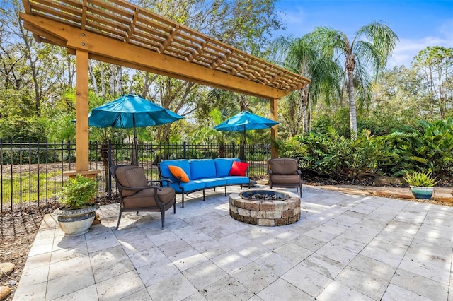 view of patio / terrace with a pergola and an outdoor living space with a fire pit