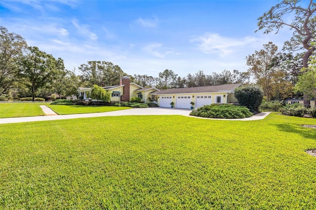 view of front facade with a garage and a front yard