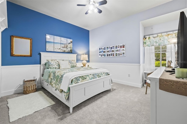 bedroom with ceiling fan and light carpet