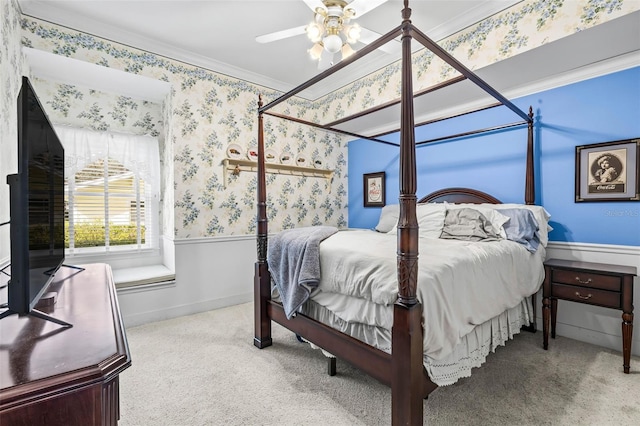 bedroom featuring crown molding, carpet floors, and ceiling fan