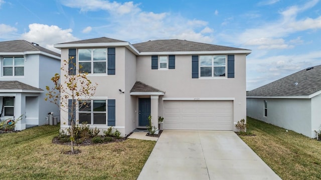 front facade featuring a front yard and a garage