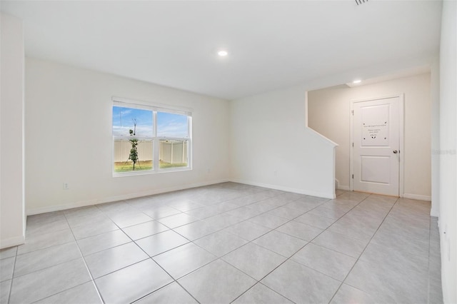 spare room with light tile patterned floors