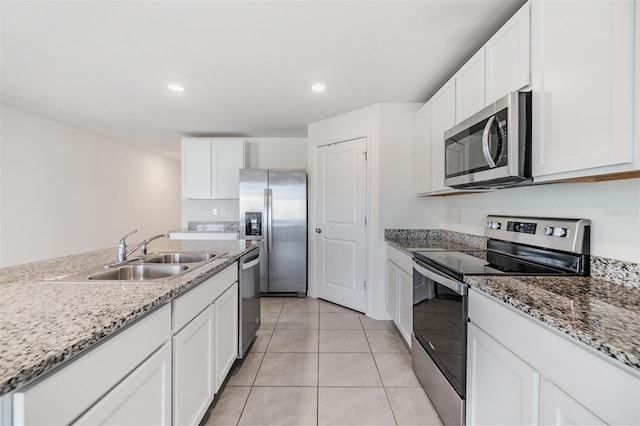 kitchen with white cabinets, sink, and stainless steel appliances