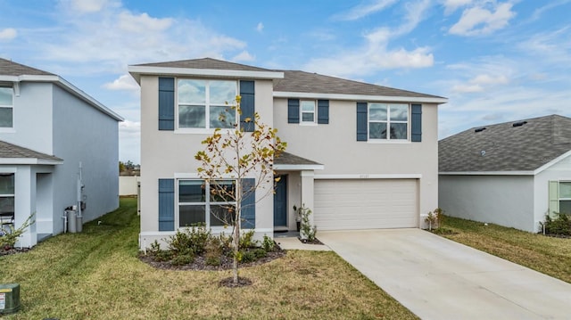 view of front of house with a front lawn and a garage