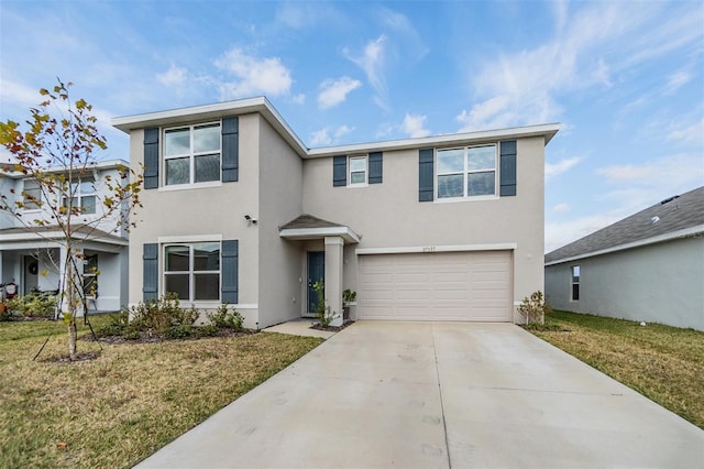 view of front of home featuring a front lawn and a garage