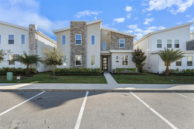 view of property with a front lawn