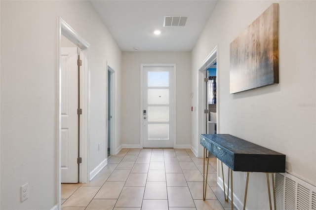 entryway featuring light tile patterned flooring